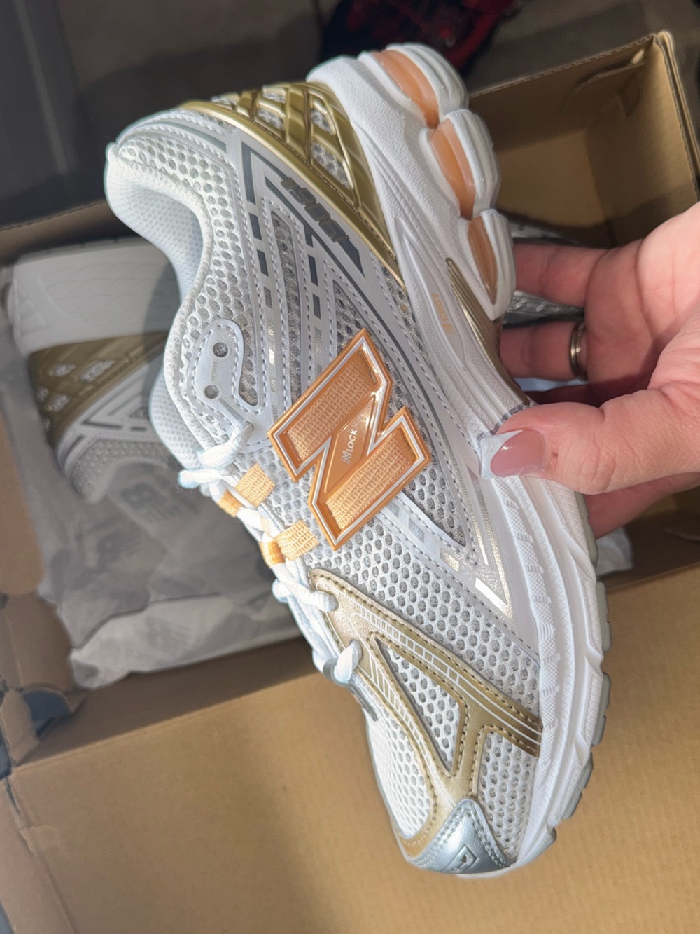 Nike Kids White Sneakers with Gold and Pale Orange Accents